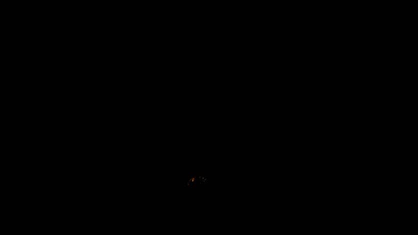Timelapse of a full blood moon rising in the darkness of night