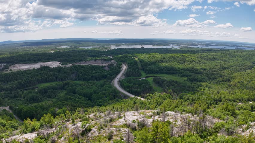 An elevated view surveys the remote natural landscape surrounding Whitefish Falls through the scenic Ontario region