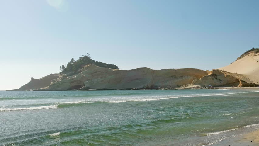 Sandstone cliffs and a large sand dune at Cape Kiwanda beach in Oregon