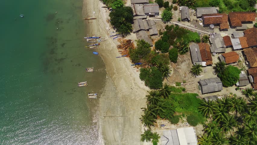 Fisherman village in tropical shoreline beach