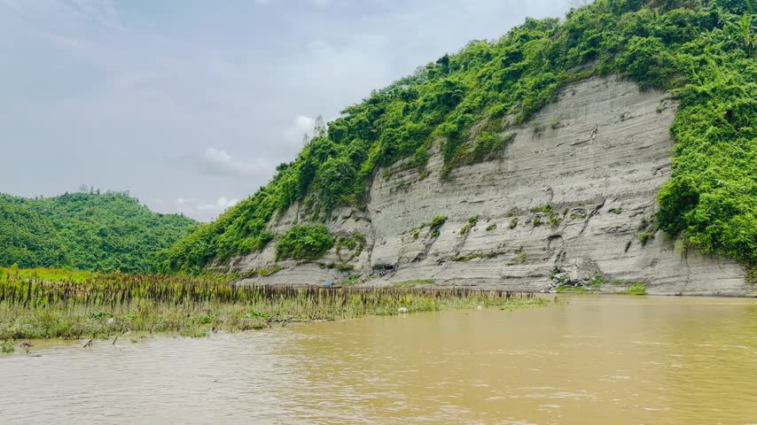 mountain river in the mountains, Beautiful Rural Countryside Scene with Boat and Lush Green Highlands.