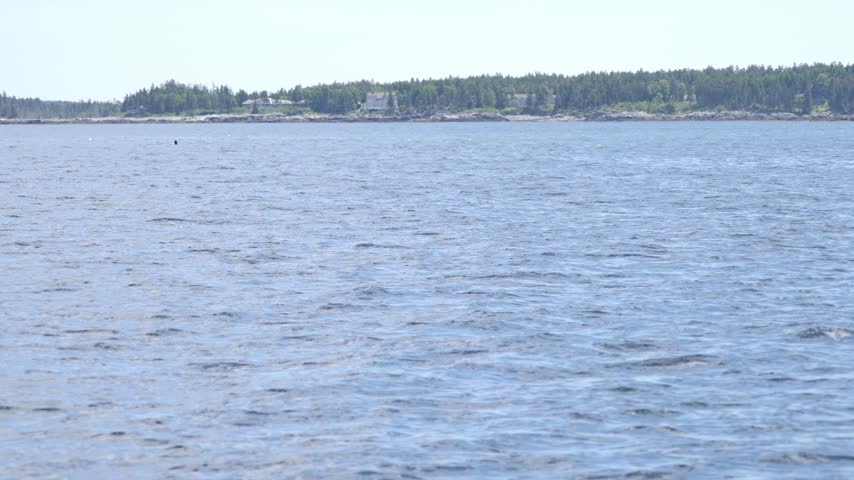 Sailboat Towing Dinghy in Great Harbor of Mount Desert Maine