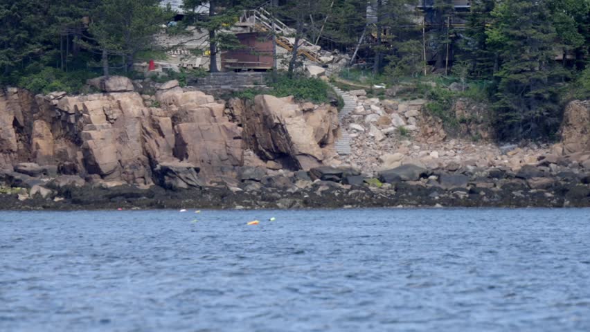Motorboat Cruising Near Rocky Coast in Mount Desert Maine