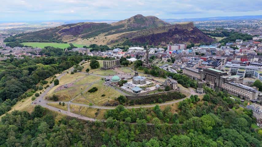 Aerial view of Calton Hill monuments with Arthurs Seat beyond Edinburgh. Scotland.