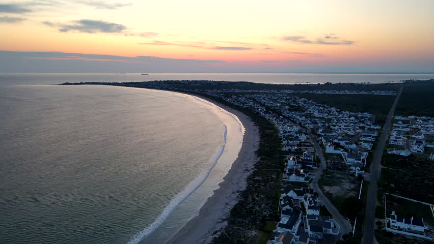Drone view of scenic Golden Mile beach at Britannia Bay at twilight (sunrise)