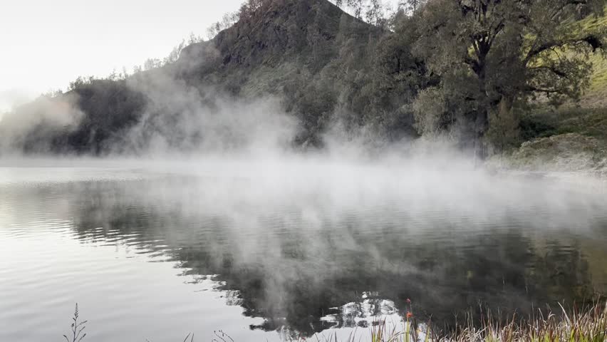 Morning mist on a lake of a mountain 