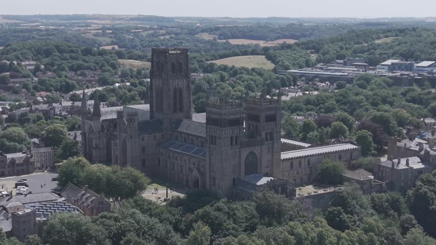 DURHAM, UK - AUGUST 2026: Scenic aerial shot of historic Durham Cathedral, River Wear and cityscape in County Durham (M-Log Flat Profile)