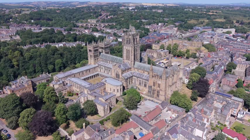 DURHAM, UK - AUGUST 2026: Scenic aerial shot of historic Durham Cathedral, River Wear and cityscape in County Durham (Color Graded)