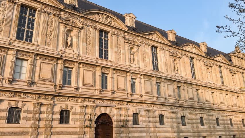 Sunset over the world-famous Louvre Museum and its historic facade