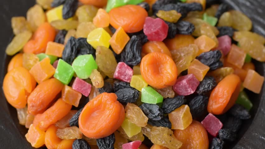 Dried apricots, raisins, and candied fruits as ingredients for baked goods and sweets. Dried fruits