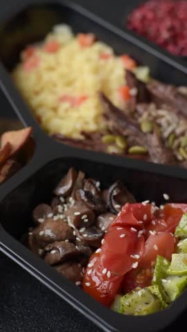 A bowl with beef, porridge, mushrooms, vegetables, sauce, and spices. Beef bowl