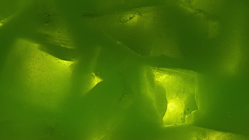 Macro Pour of Milk Into Iced Matcha Latte , Super Slow Motion