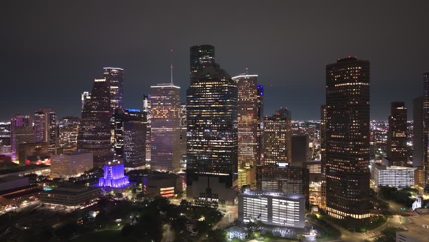 Downtown Houston skyline from above at night. Modern skyscrapers and transportation corridors shape this iconic Texas city.