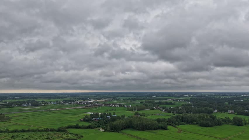 time-lapse,Aerial panoramic rural landscape under heavy overcast storm clouds