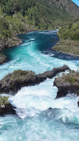 Petrohue Waterfall At Petrohue In Los Lagos Chile. Volcano Landscape. Sky Clouds Background. Los Lagos Chile. Todos Os Santos Mountain. Petrohue Waterfall At Petrohue In Los Lagos Chile.