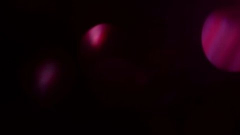 Dark, blurred, bokeh lights background. Abstract sparkles. Full HD loop, 1080p.
