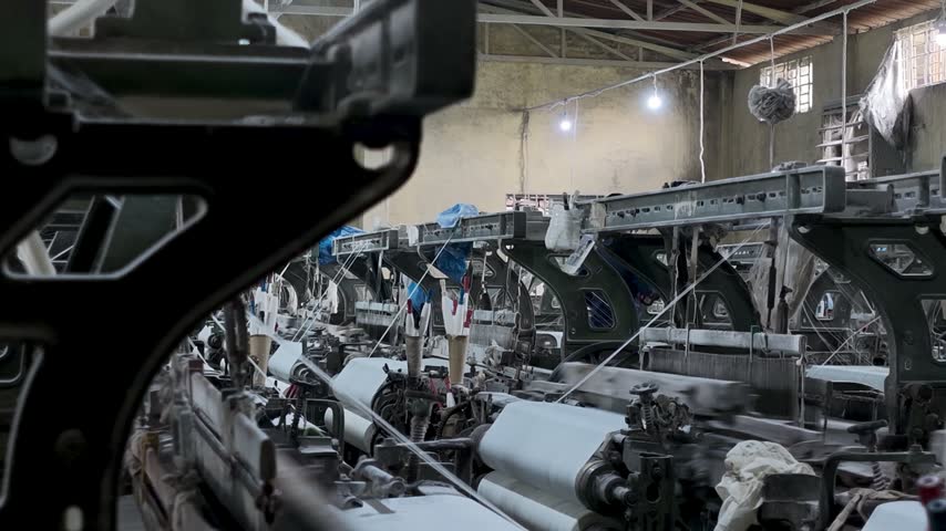 Close-up View Of Power Loom Machinery In Textile Mill