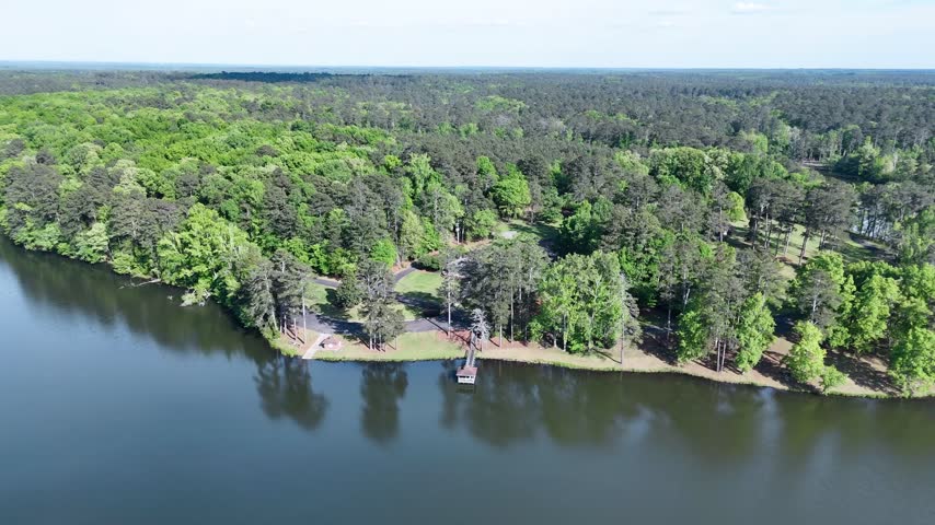Aerial view of wooded peninsula extending into lake at Rock Eagle in Putnam County Georgia