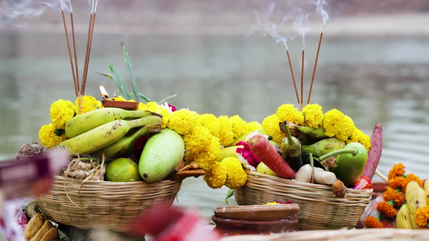 Devotional Chhath Puja Offerings Featuring Fruits Flowers Earthen Pot And Incense Sticks shot is taken at holy chhath puja celebration.