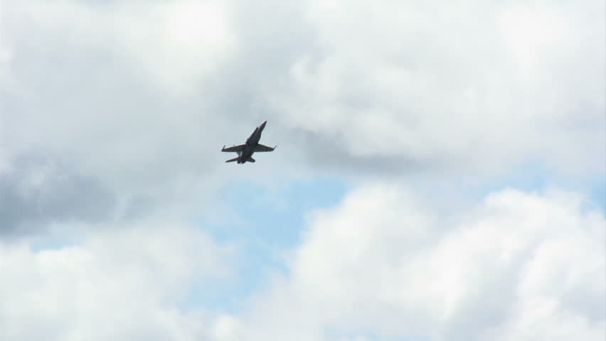 US Navy fighter plane flies at a hard angle of attack, something which would have caused aircraft built in earlier times to stall.