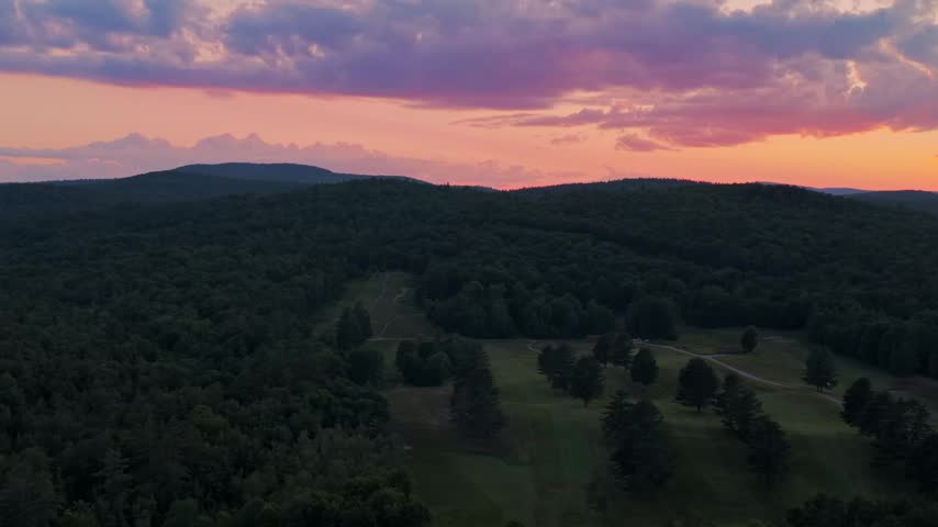 Adirondack Mountain layers Schroon Lake golf course vibrant sunset golden hour clouds New York State aerial drone high peaks layers Mount Severance Pharaoh Lake Wilderness forward