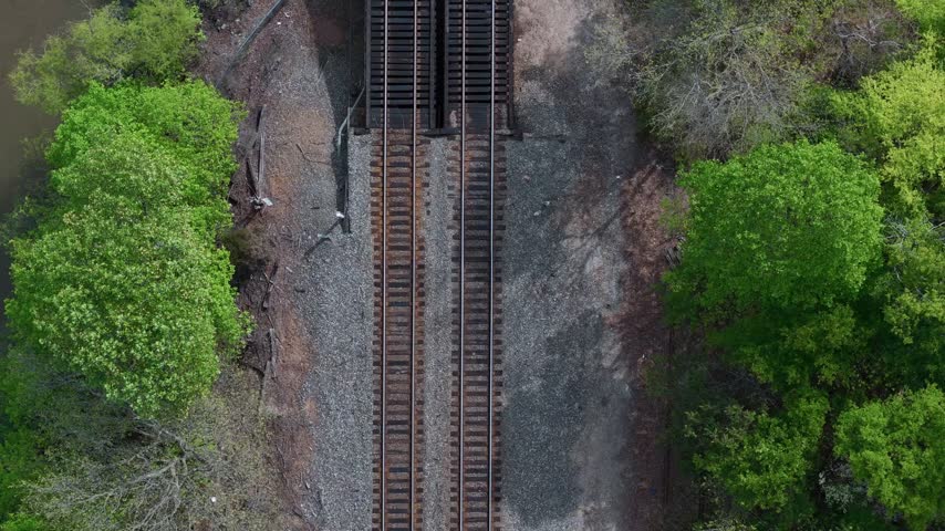 Top down aerial view of railroad tracks and ballast near Lake Cooley in South Carolina