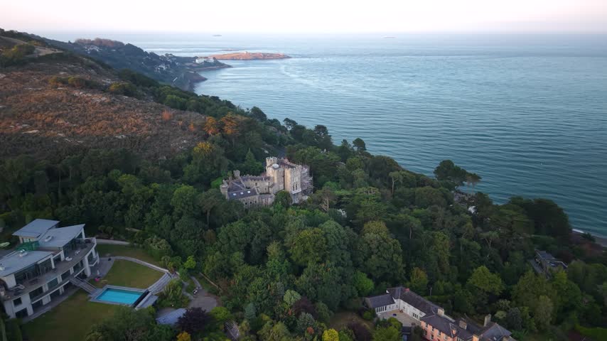 Aerial of Manderley Castle and surrounding woodland and coastal near Dublin, Ireland