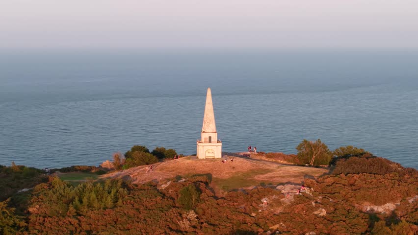 Killiney Hill Obelisk sunset viewpoint overlooking Dublin Bay, popular travel destination in Ireland