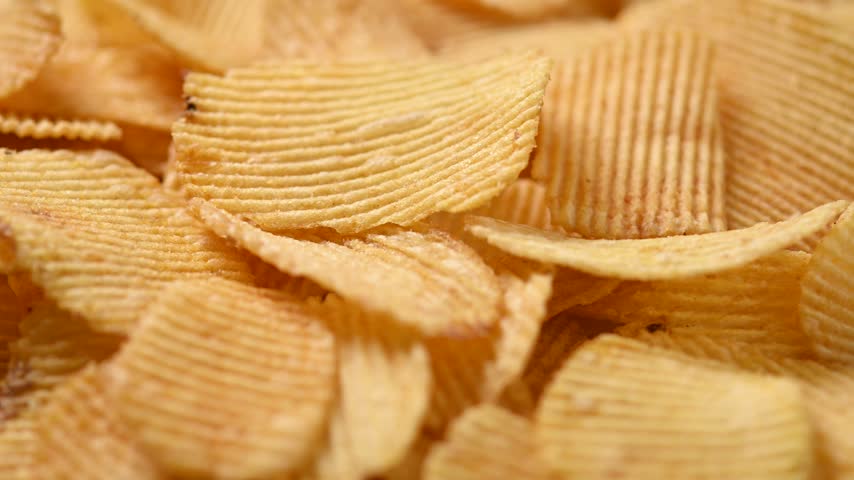 Potato Chips Rotating background. Close up