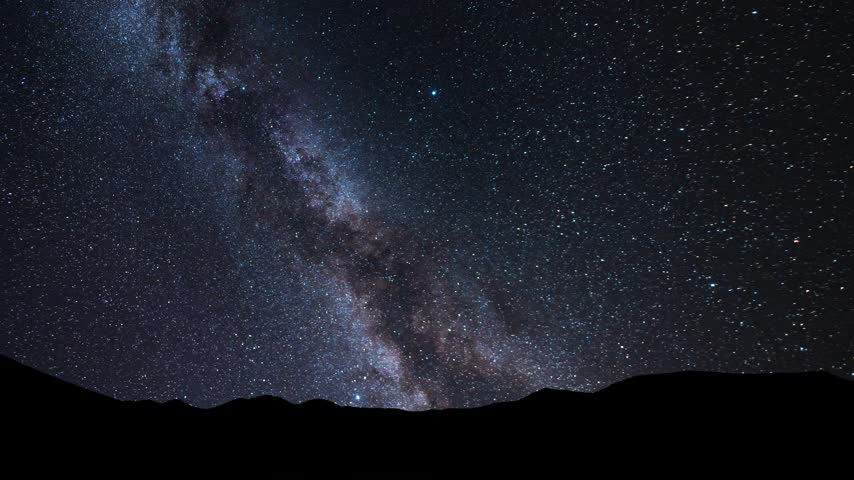 Night mountains  landscape under bright colorful milky way galaxy. Space,  starry sky time lapse.