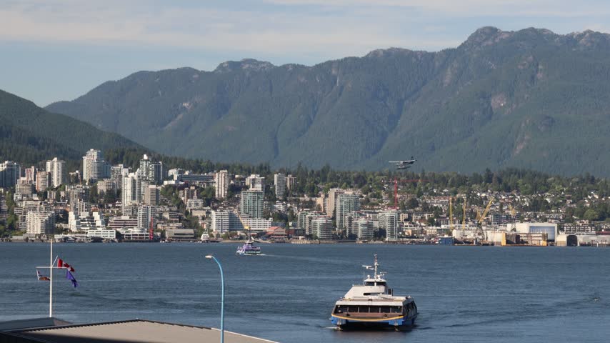 Ferry from North Vancouver arriving across the harbour, traffic in the bay