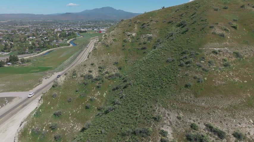 Aerial view of a road winding through a green hillside near Emmett, Idaho, United States.