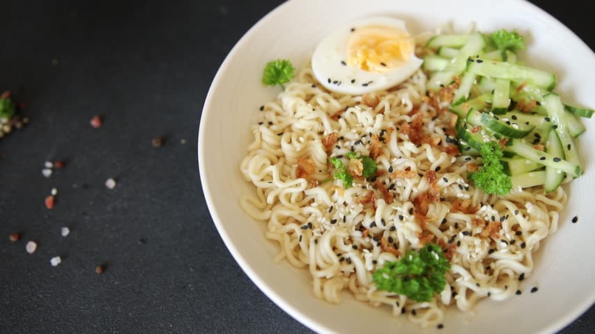 Noodle bowl no meat broth, egg, vegetables vegetarian dish delicious appetizer fresh and delicious gourmet food background on the table traditional rustic food top view copy space