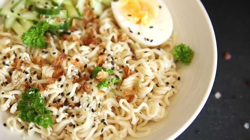 Noodle bowl no meat broth, egg, vegetables vegetarian dish delicious appetizer fresh and delicious gourmet food background on the table traditional rustic food top view copy space