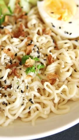 Noodle bowl no meat broth, egg, vegetables vegetarian dish delicious appetizer fresh and delicious gourmet food background on the table traditional rustic food top view copy space