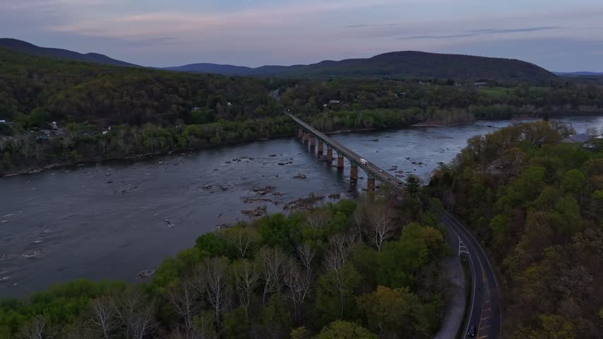 Aerial view of bridge and Potomac River valley near Harpers Ferry West Virginia at dusk