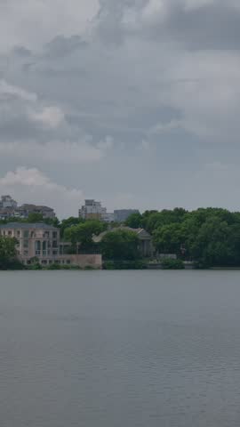 Calm lakeside trees and buildings at Baijia Lake, Nanjing Jiangsu China