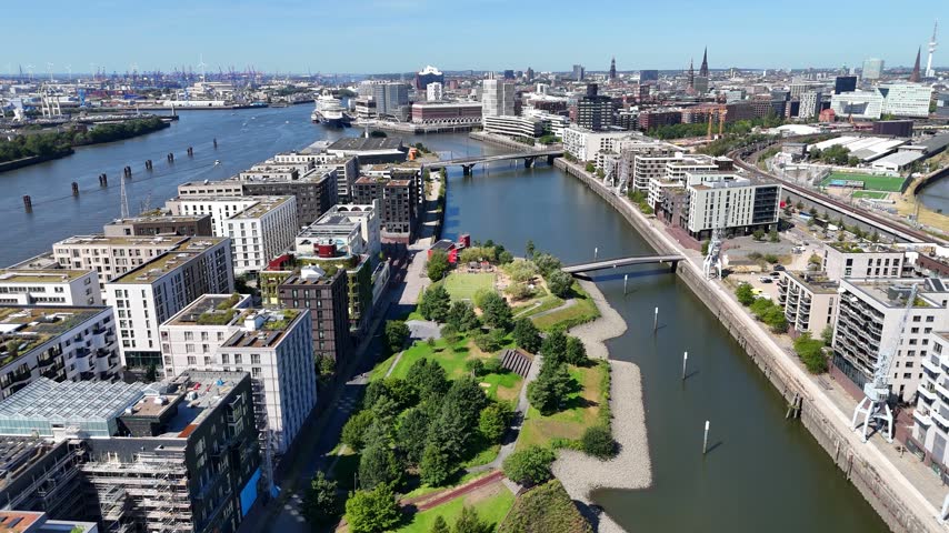 Aerial view of Baakenhafen in the Hafencity with modern residential buildings and green spaces along the river in Hamburg, Hamburg, Germany.