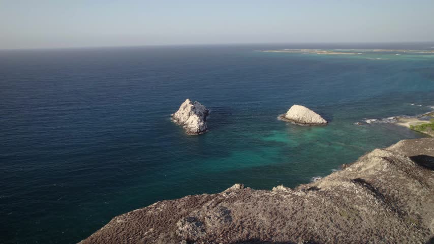 Aerial View of Historic Lighthouse on Rocky Island Coast