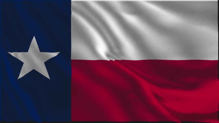 Texas flag waving slowly in the foreground