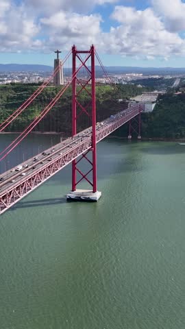 25 Of April Bridge In Lisbon Portugal. Birds Eye View Of Suspension Bridge With Cars Driving Across. Cities Of The World. Landmark Cityscape. Lisbon Portugal.