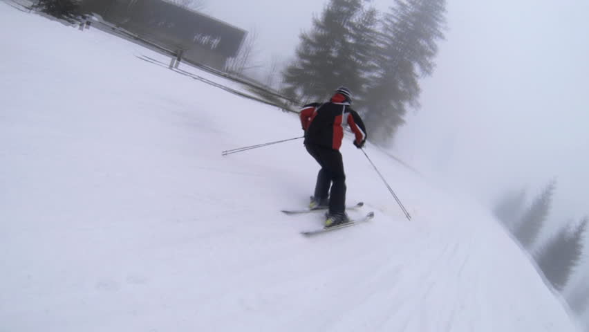 Motion camera view of skier is riding in the mountains.