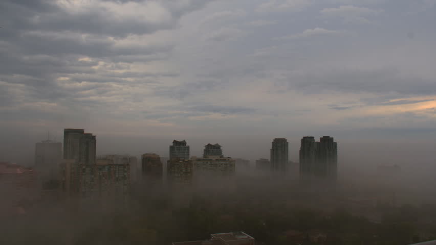 Foggy City Day Time-Lapse 2. Timelapse shot of a city early in the morning
