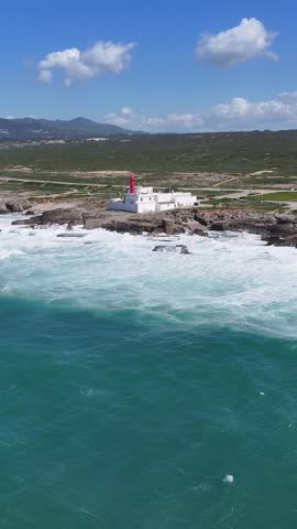 Shallow Cape Lighthouse In Cascais District Of Lisbon Portugal. Aerial View Of A Bustling Ligthhouse In A Coast City. Summer Backgrounds. Seaside Beach. Cascais District of Lisbon.