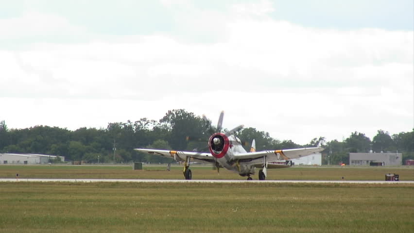 Thunderbolt, WWII fighter plane, comes to a stop while taxiing. High shutter