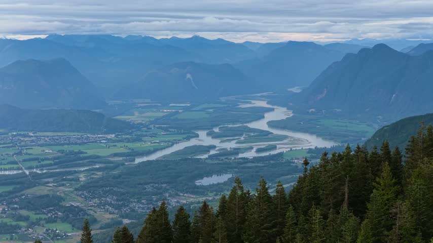 Majestic Valley Landscape with Winding River and Mountains in British Columbia, Canada