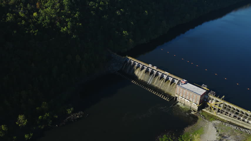 High aerial over Remmel Dam and reservoir in Arkansas, drone descends, medium backdrop, Ouachita River Jones Mill Arkansas USA