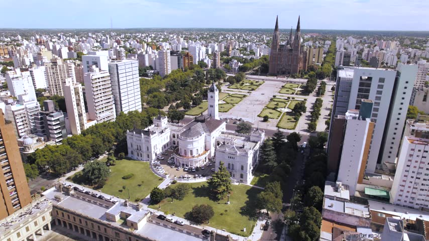4K drone aerial view of Plaza Moreno in La Plata, Buenos Aires, Argentina. Historic central square surrounded by the Cathedral, government buildings, green spaces and the urban heart of the city.
