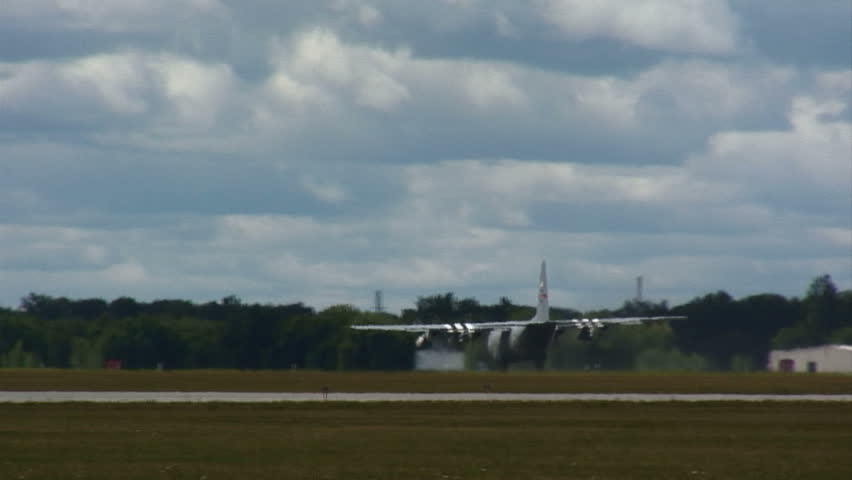 Lockheed Hercules military transport aircraft making a short take-off.