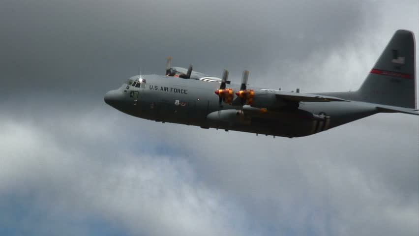 Lockheed Hercules C-130 military transport aircraft flying in formation with a